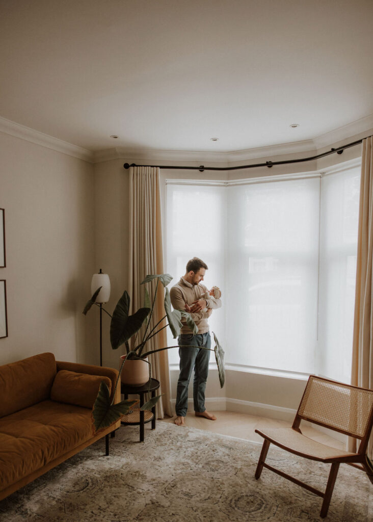 A soft and intimate in-home newborn photography session in East Dulwich, showcasing the quiet beauty of early parenthood